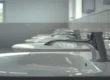 Lavabi e rubinetti di un bagno scolastico, punto critico per la Legionella nelle scuole